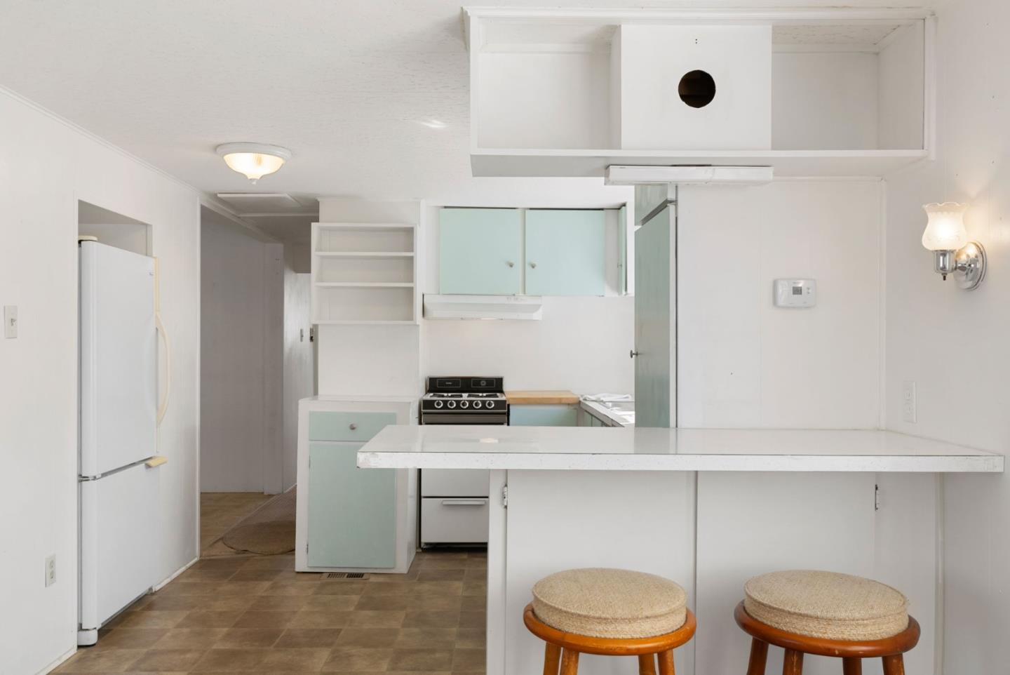 750 47th Avenue, Unit 53 Capitola, CA 95010 - Photo 11 of 39 a room with a cabinets and a fireplace