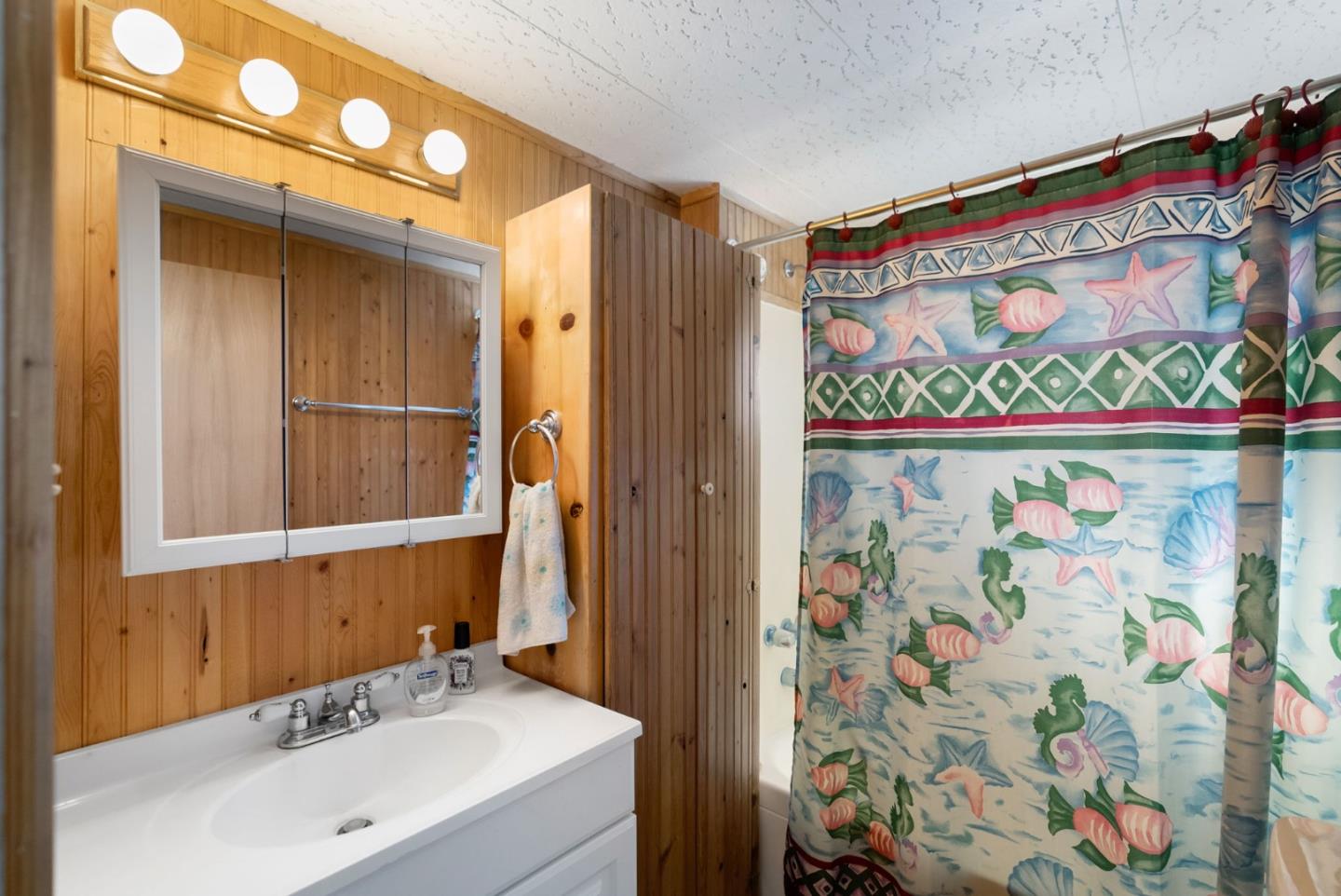 750 47th Avenue, Unit 53 Capitola, CA 95010 - Photo 16 of 39 a bathroom with a sink and a mirror