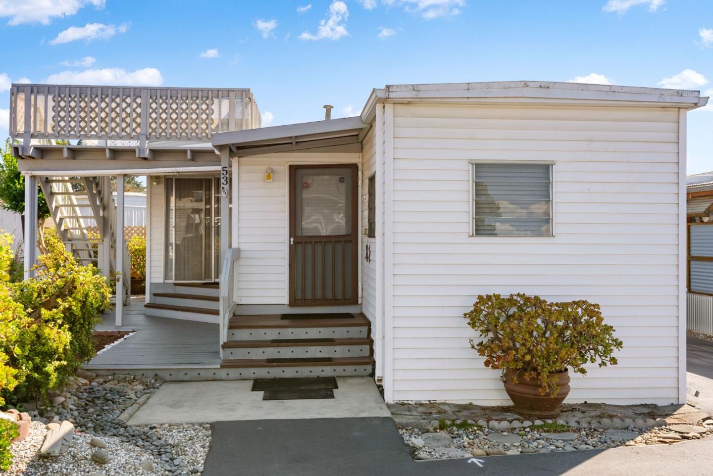 750 47th Avenue, Unit 53 Capitola, CA 95010 - Photo 22 of 39 a front view of a house with potted plants