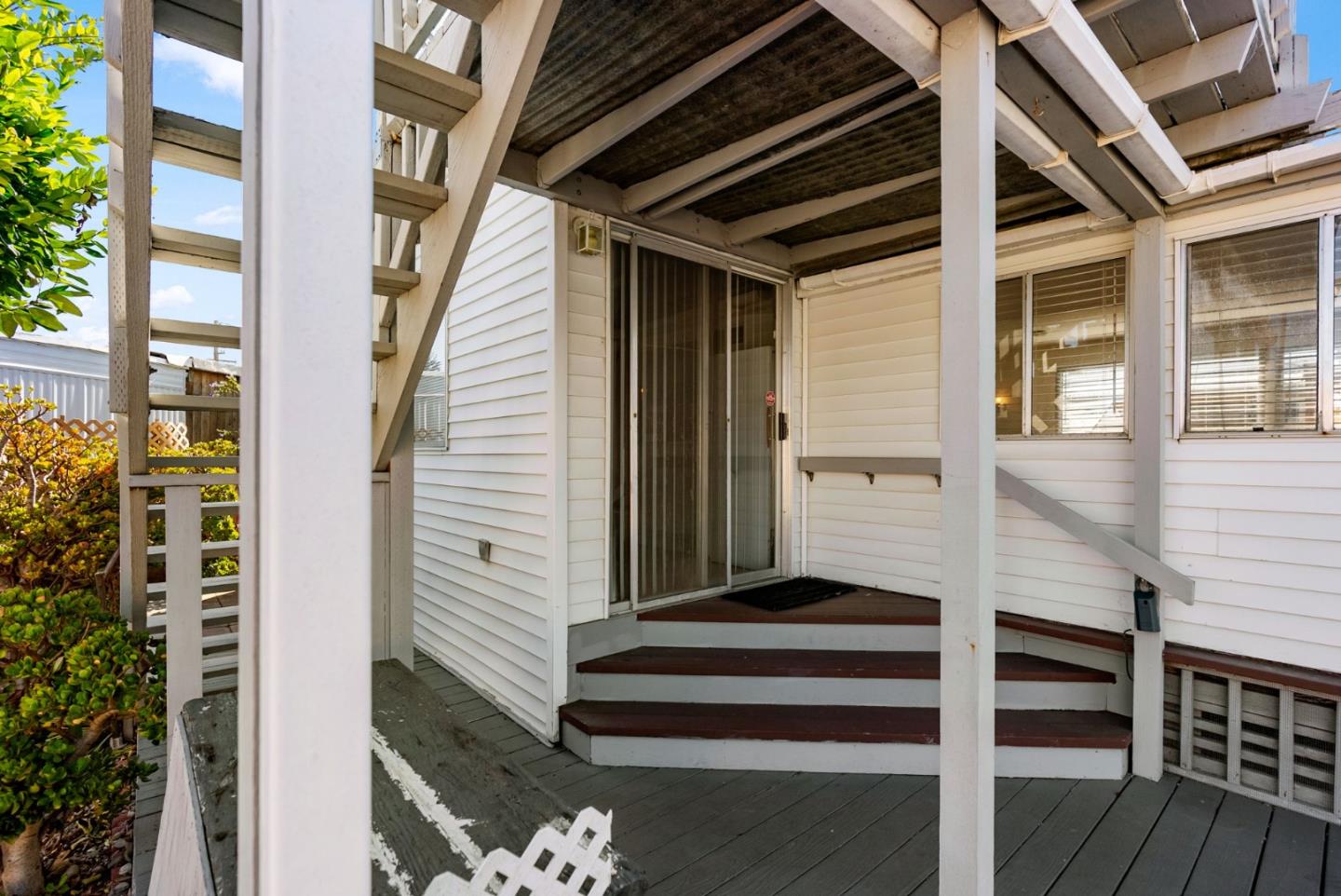 750 47th Avenue, Unit 53 Capitola, CA 95010 - Photo 3 of 39 a view of a balcony with wooden floor and fence