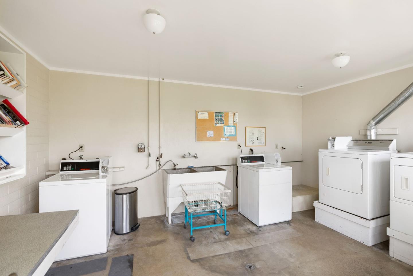 750 47th Avenue, Unit 53 Capitola, CA 95010 - Photo 39 of 39 a kitchen with a sink stove and wooden cabinets