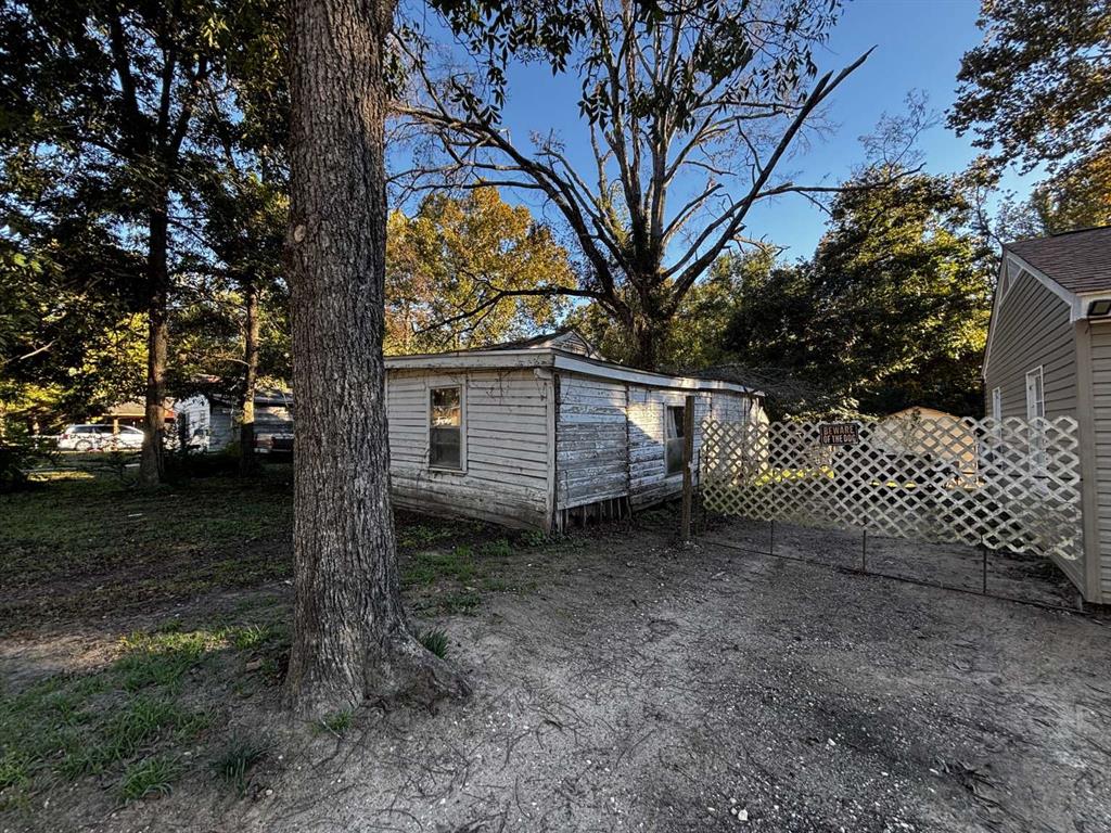 407 South Park Drive Springhill, LA 71075 - Photo 8 of 10 a view of a yard with a tree
