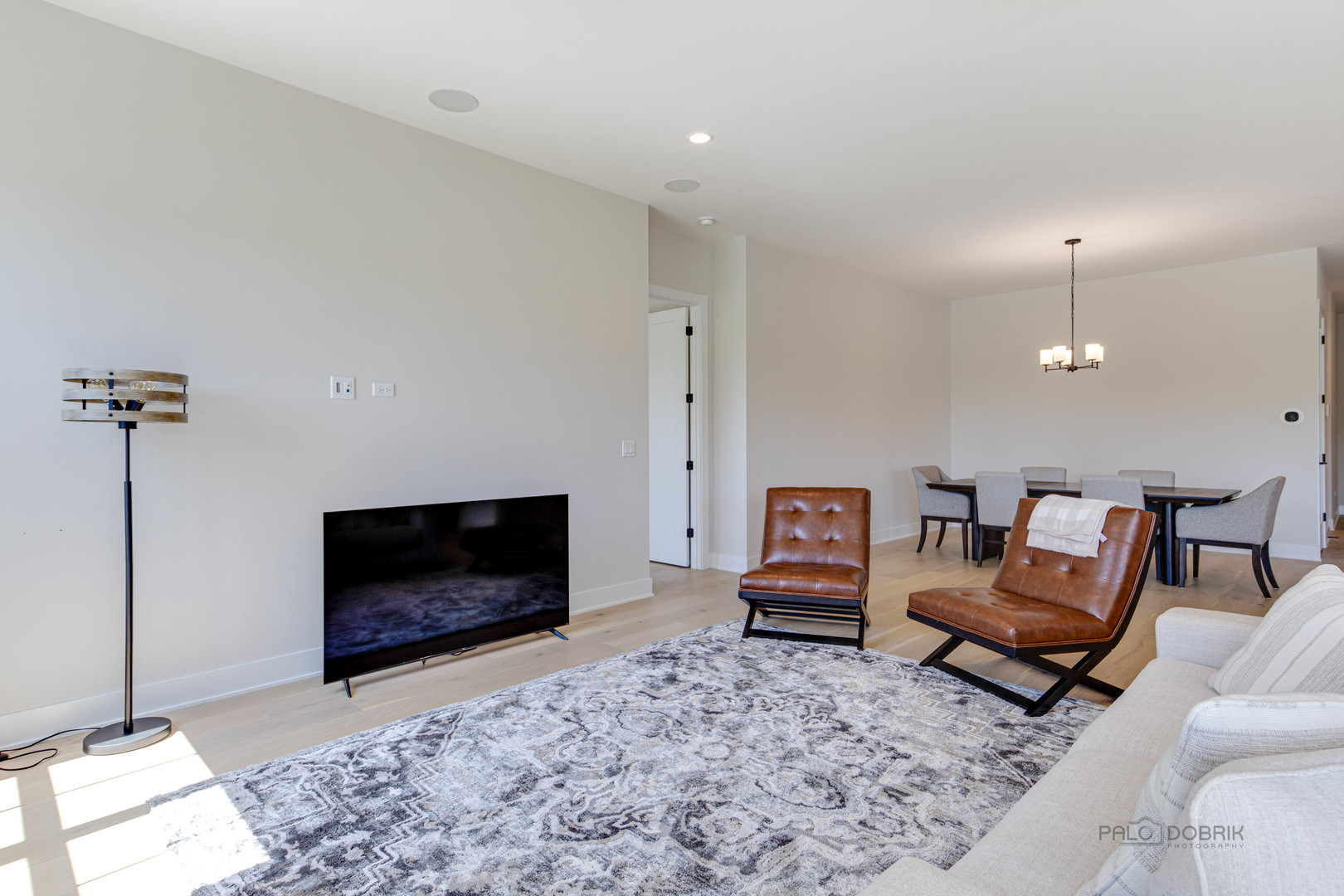 3531 South Riding Ridge Elgin, IL 60124 - Photo 11 of 36 a living room with furniture a flat screen tv and a fireplace