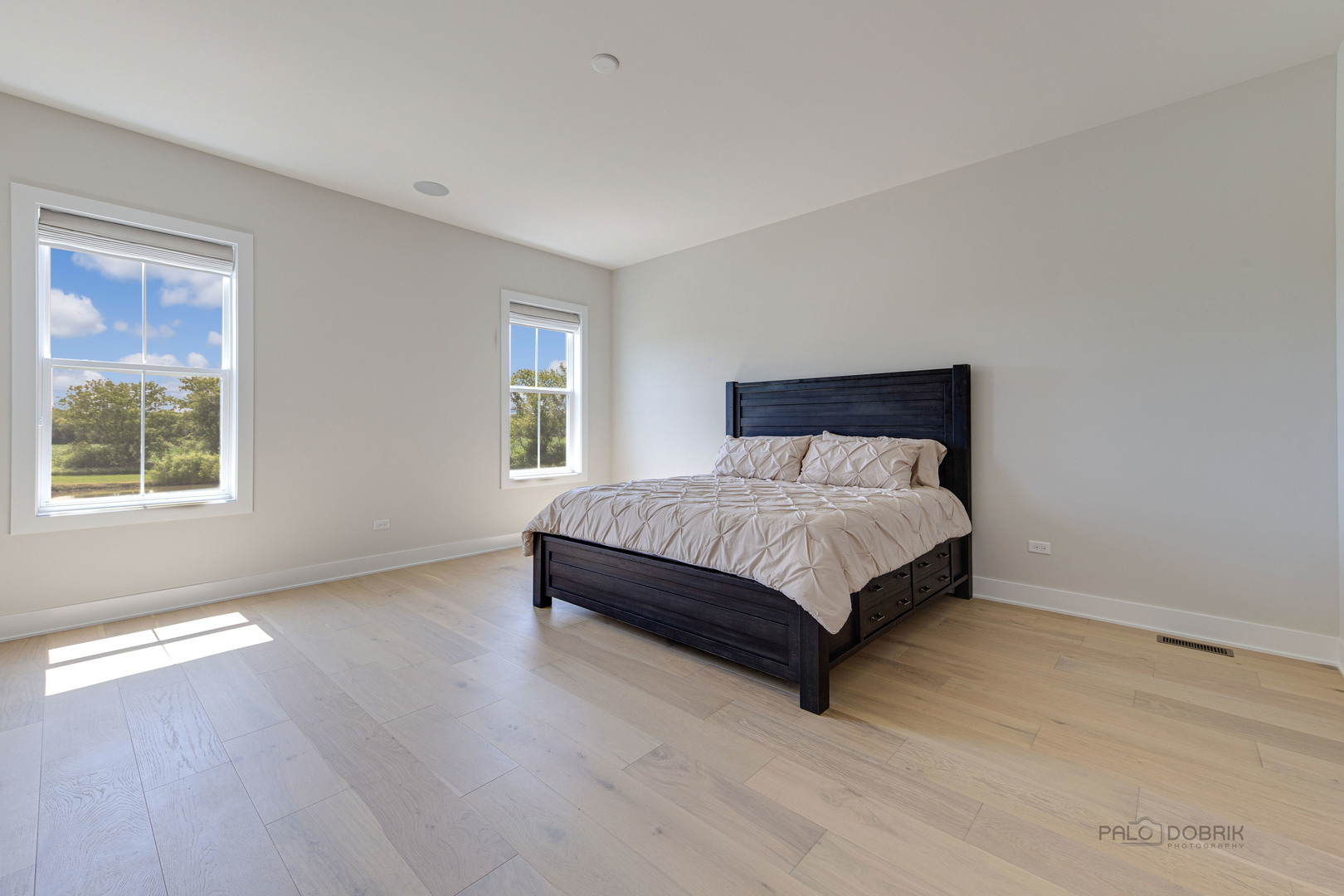 3531 South Riding Ridge Elgin, IL 60124 - Photo 18 of 36 a bedroom with a bed lamp and window