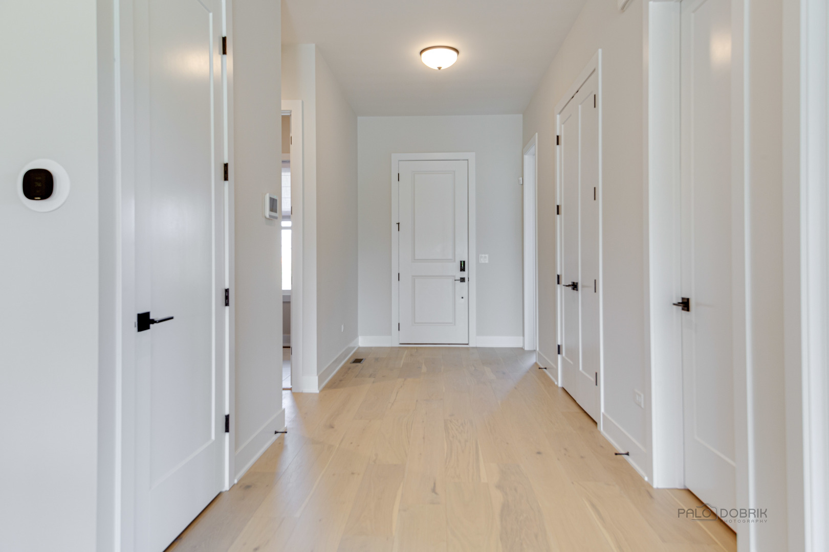 3531 South Riding Ridge Elgin, IL 60124 - Photo 2 of 36 a view of a hallway with wooden floor