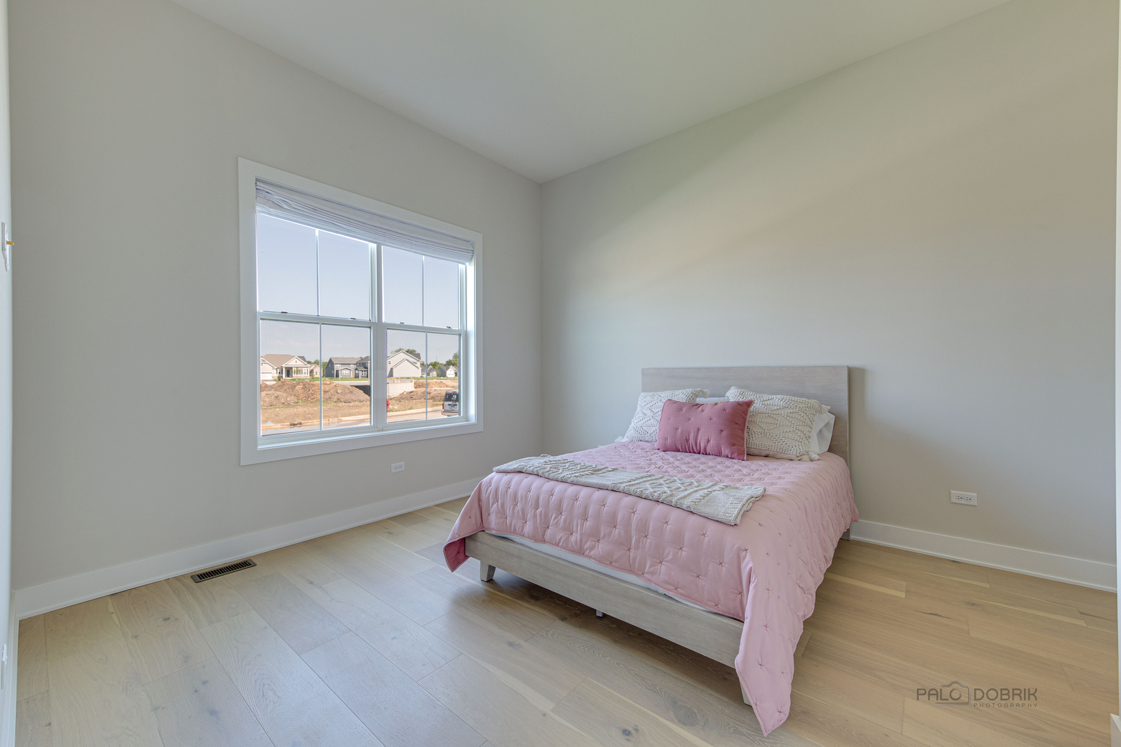 3531 South Riding Ridge Elgin, IL 60124 - Photo 28 of 36 a bedroom with a bed and window