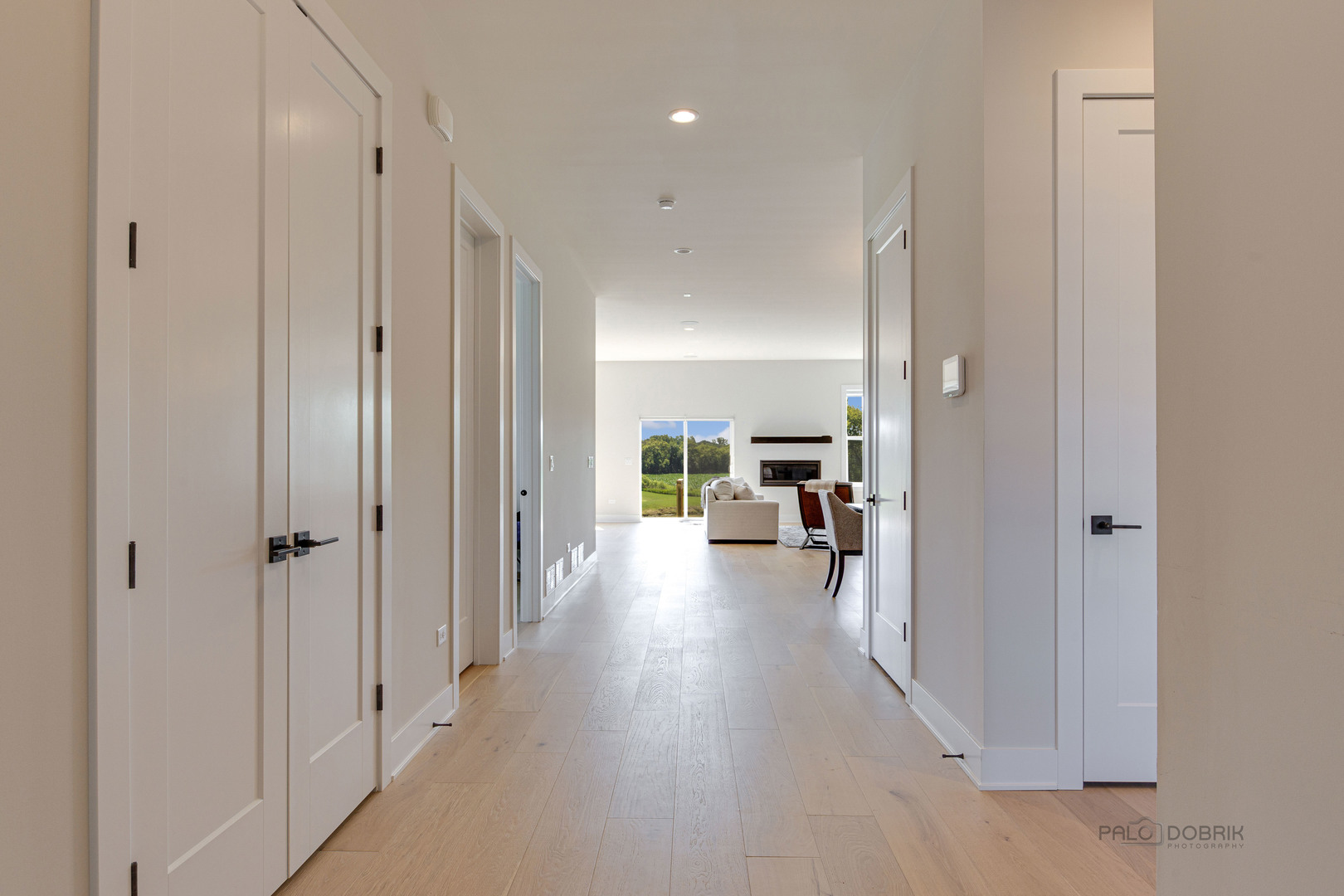 3531 South Riding Ridge Elgin, IL 60124 - Photo 3 of 36 a view of a hallway view of a livingroom and a dinning area with furniture