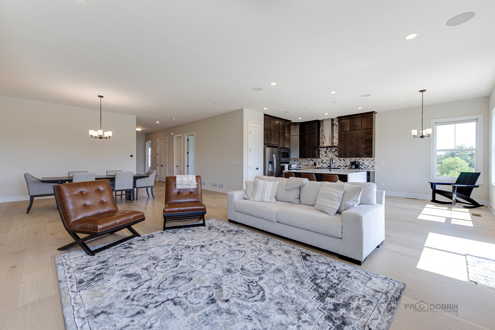 3531 South Riding Ridge Elgin, IL 60124 - Photo 10 of 36 a living room with furniture and a view of kitchen