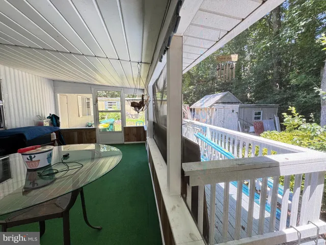 a view of a balcony and chairs