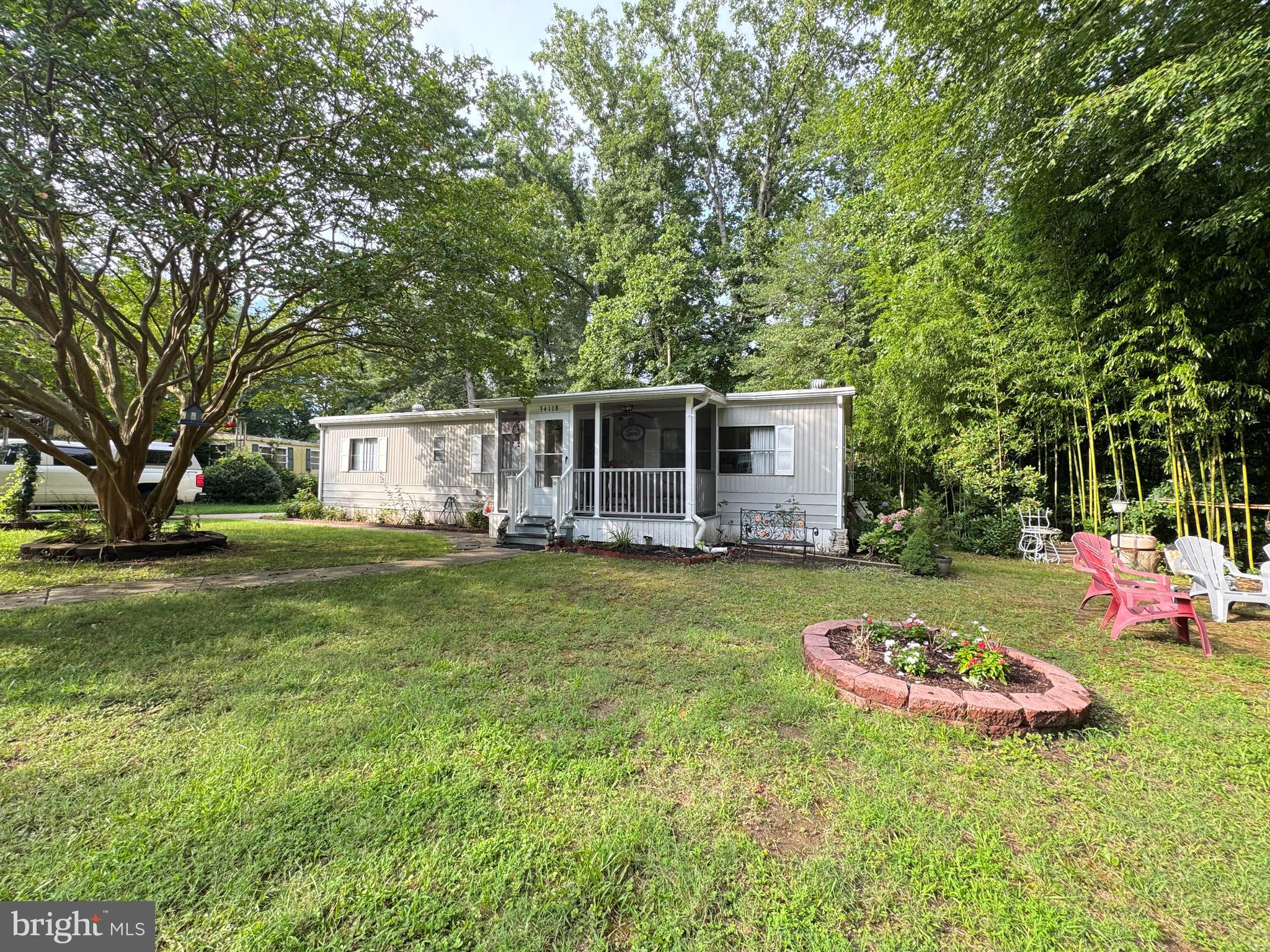 34118 Pinewood Circle, Unit 11080 Lewes, DE 19958 - Photo 4 of 22 a view of a house with backyard and garden
