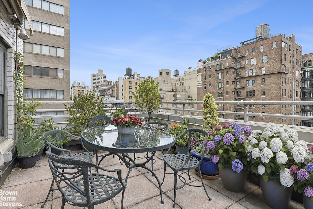 35 East 75th Street, Unit 11AB Manhattan, NY 10021 - Photo 10 of 12 a building view with outdoor seating space and potted plants