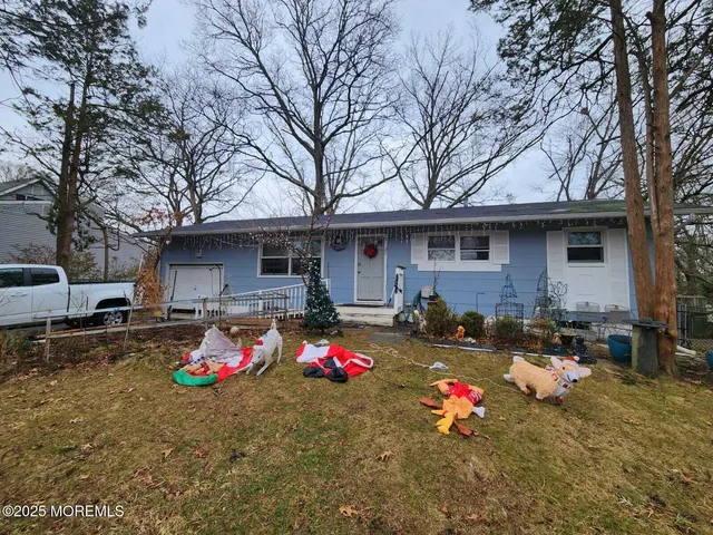 a front view of a house with yard