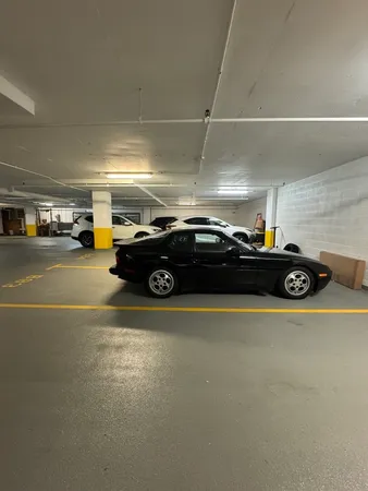 a view of garage with cars