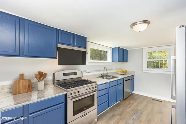 a kitchen with a stove and a sink