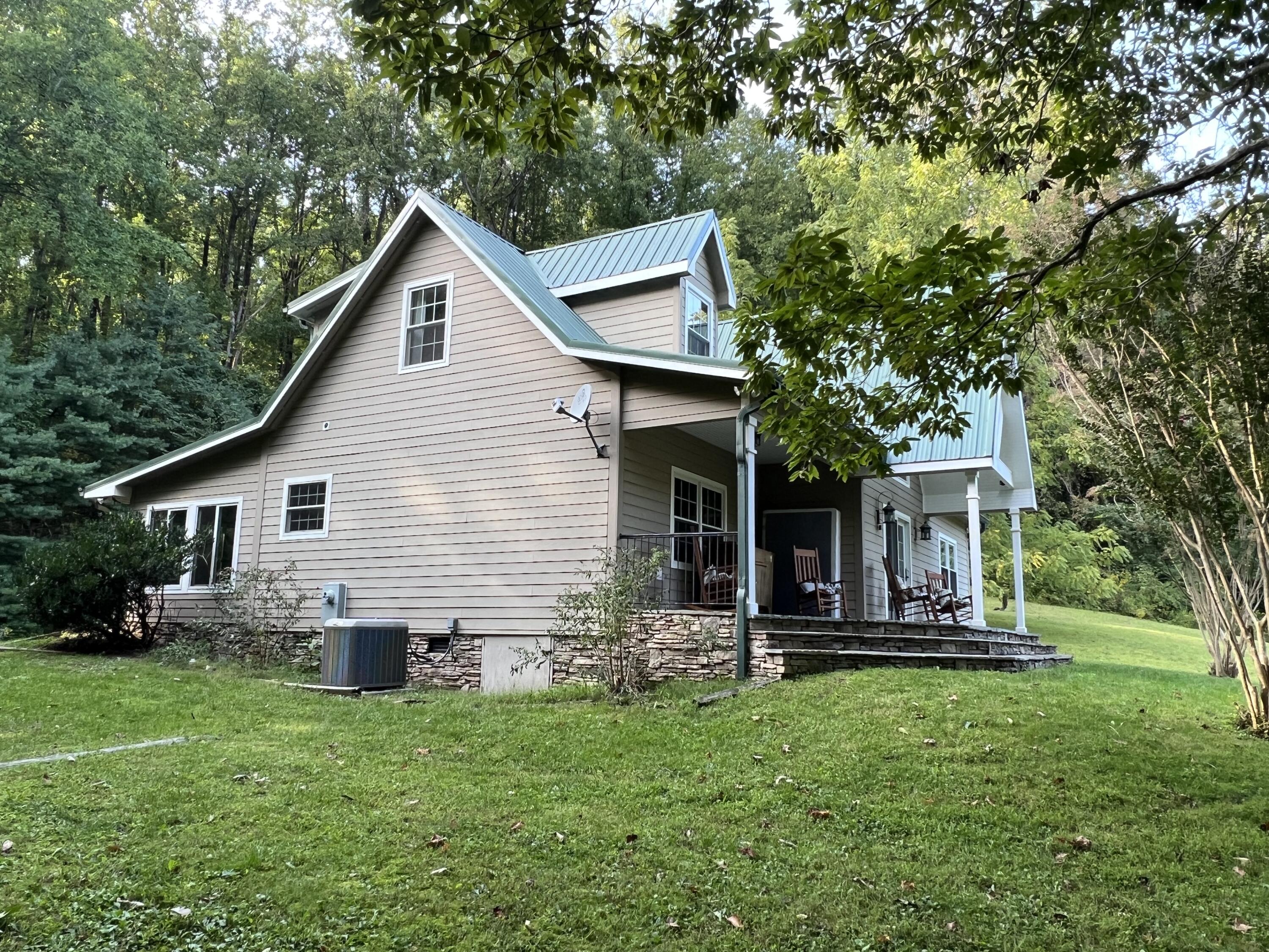 1423 North Fork Road Stuart, VA 24171 - Photo 2 of 78 a view of a house with backyard and garden