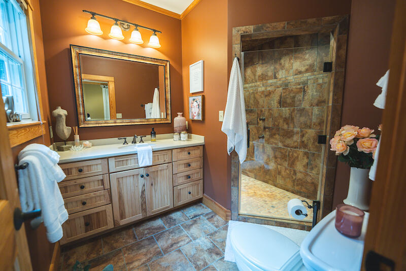 1423 North Fork Road Stuart, VA 24171 - Photo 41 of 78 a bathroom with a double vanity sink mirror and shower