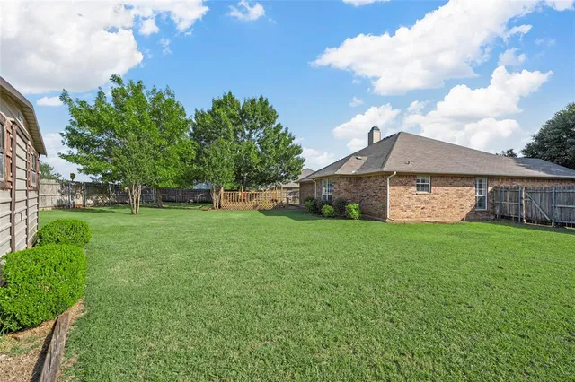 a view of a park with large trees