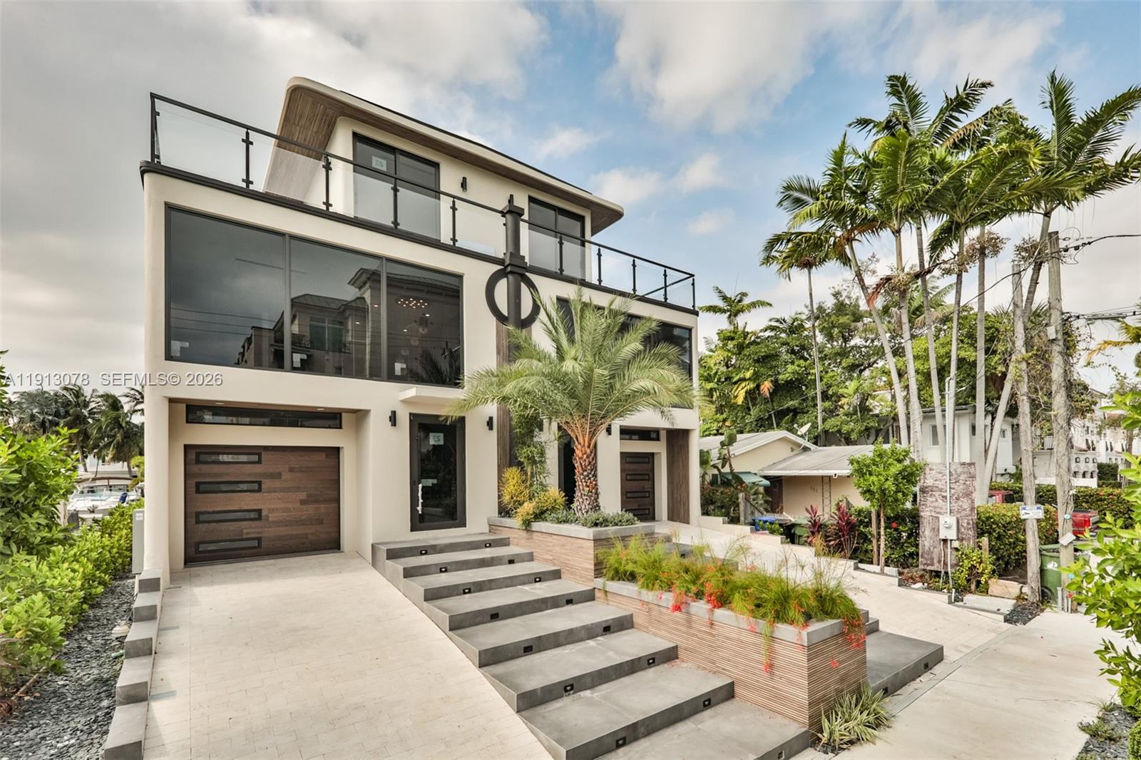 321 Hendricks Isle Fort Lauderdale, FL 33301 - Photo 1 of 7 a front view of a house with a yard