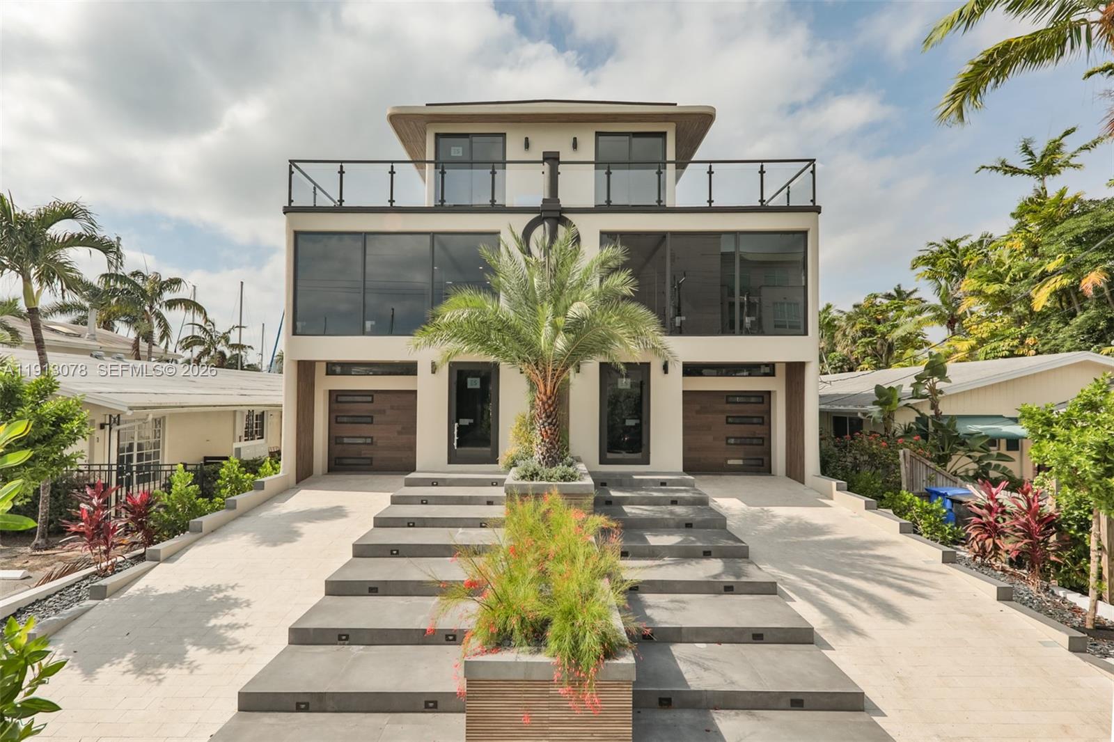 321 Hendricks Isle Fort Lauderdale, FL 33301 - Photo 7 of 7 a front view of a house with a yard