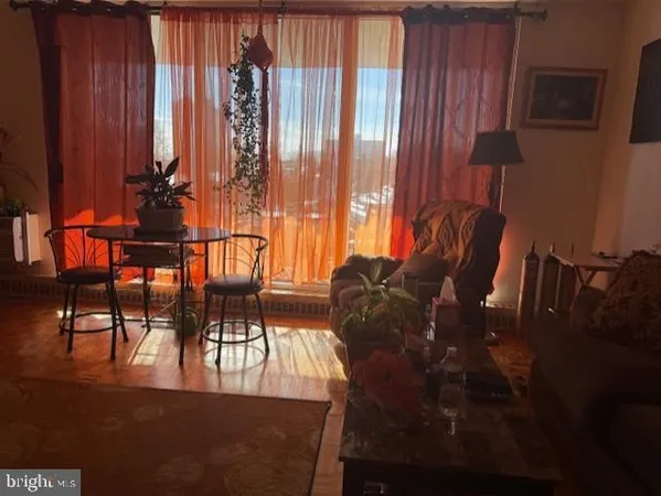 a view of a room with furniture and a window