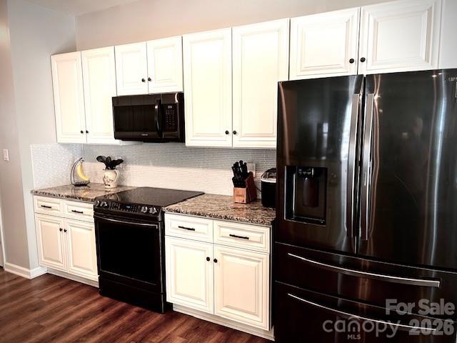 8006 Fine Robe Drive Indian Trail, NC 28079 - Photo 12 of 25 a kitchen with a refrigerator stove and white cabinets