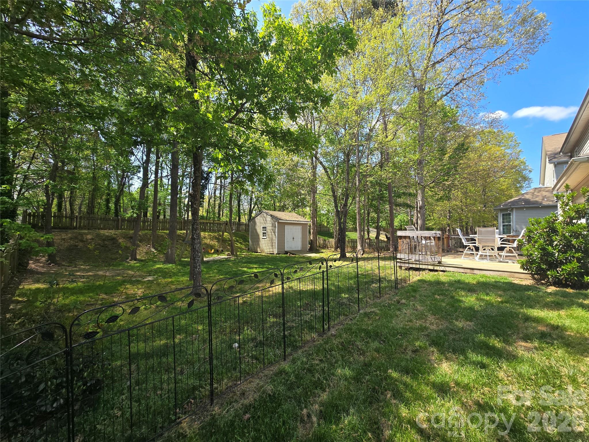8006 Fine Robe Drive Indian Trail, NC 28079 - Photo 25 of 25 a backyard of a house with table and chairs