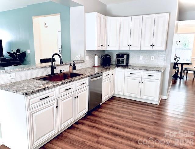 8006 Fine Robe Drive Indian Trail, NC 28079 - Photo 10 of 25 a kitchen with granite countertop white cabinets and white appliances