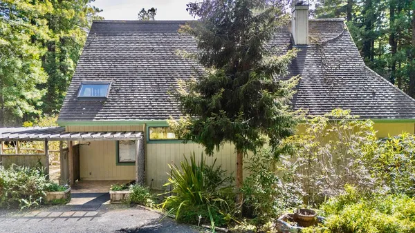front view of a house with a small yard