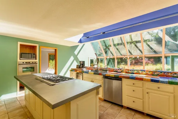 a kitchen with sink and refrigerator