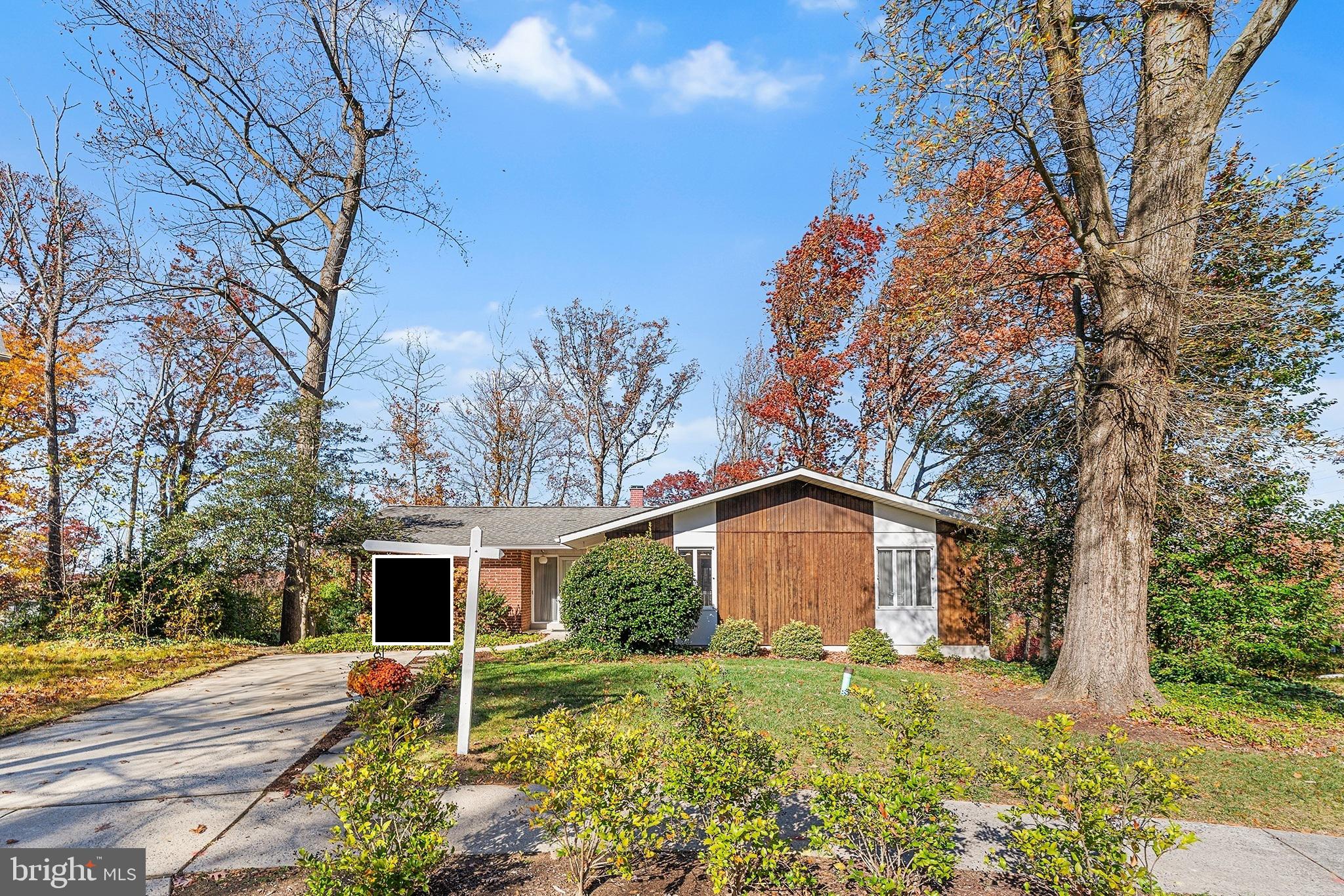 a house with trees in the background