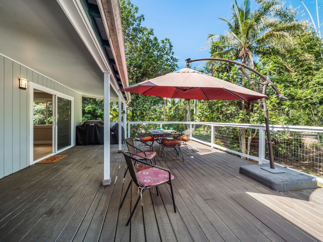 84-5085 Painted Church Road Honaunau, HI 96704 - Photo 20 of 30 a view of a chairs and table on the wooden deck