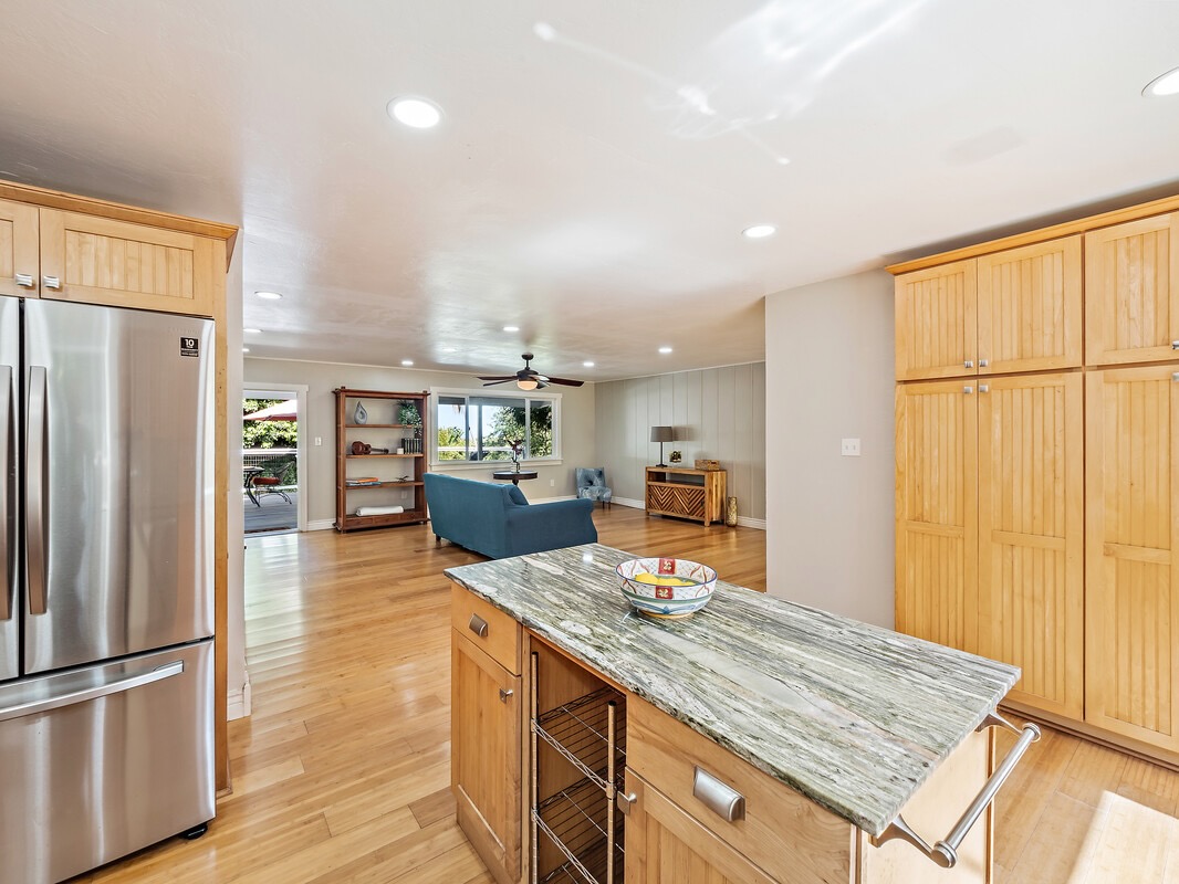 84-5085 Painted Church Road Honaunau, HI 96704 - Photo 4 of 30 a kitchen with stainless steel appliances granite countertop a refrigerator and a sink