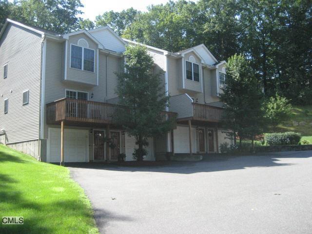 40 Trolley Bridge Road, Unit 3 Shelton, CT 06484 - Photo 1 of 1 a front view of a house with a yard and garage