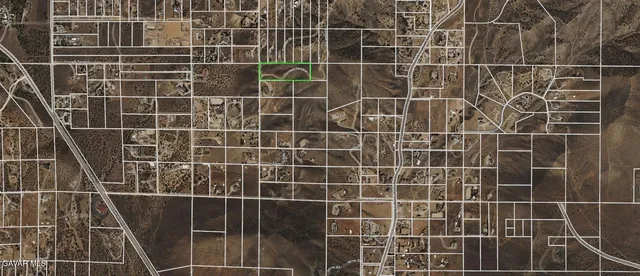 a view of a town with mountains in the background