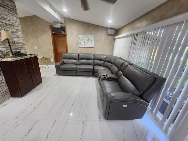 a living room with furniture and a rug