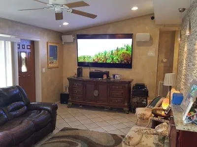 a living room with furniture and a flat screen tv