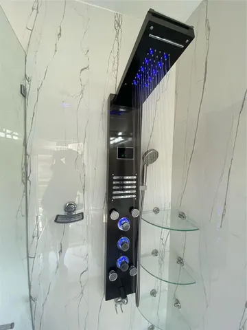 a bathroom with a bathtub and shower