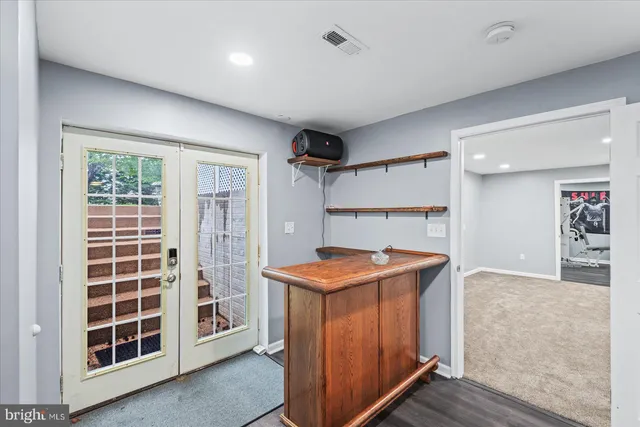 a view of backyard of house with green space