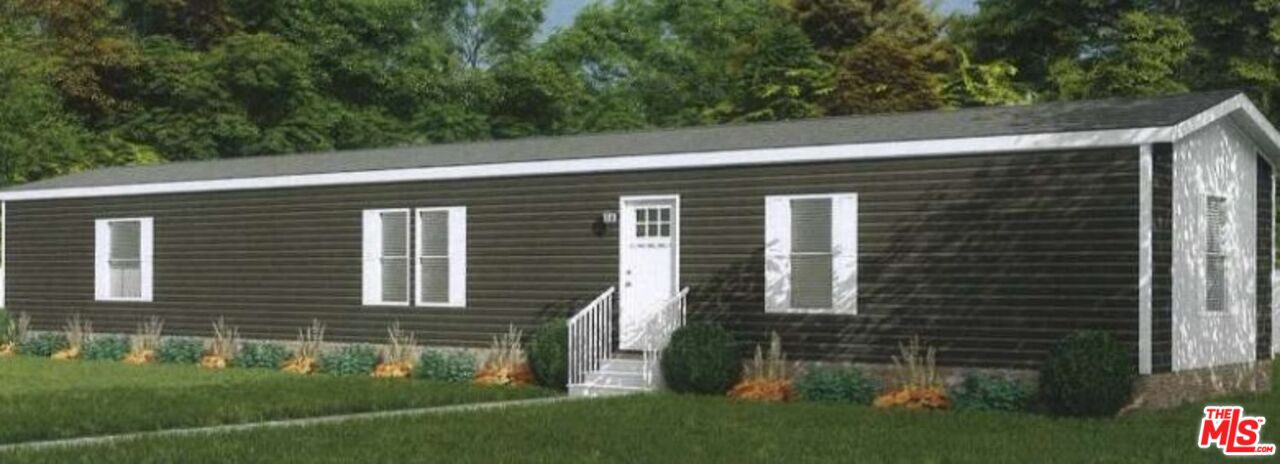 39600 Knob Hill Road, Unit 2 Big Bear City, CA 92314 - Photo 1 of 6 a view of a house with a yard