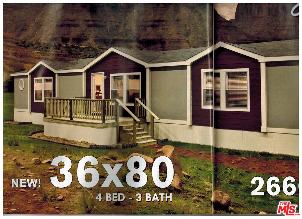 39600 Knob Hill Road, Unit 2 Big Bear City, CA 92314 - Photo 3 of 6 a front view of a house with windows