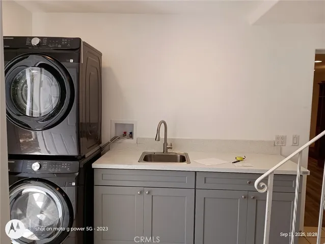 a view of a hallway with washer and dryer