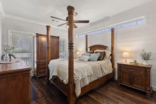 a bedroom with a bed and a dresser