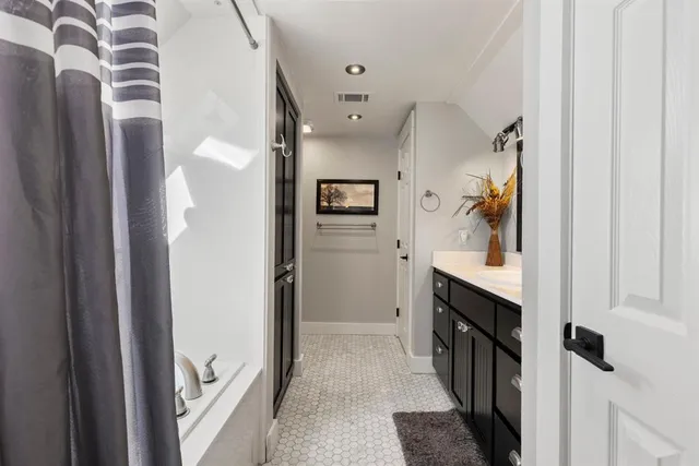 a view of a hallway to a livingroom and a hallway