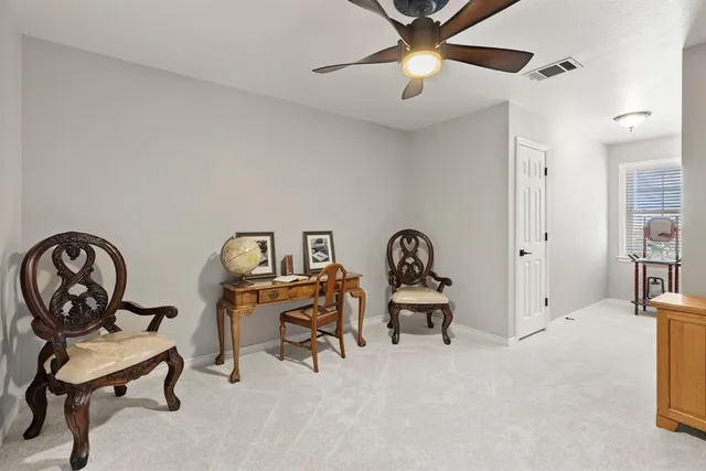 a view of a hallway to a livingroom and a hallway