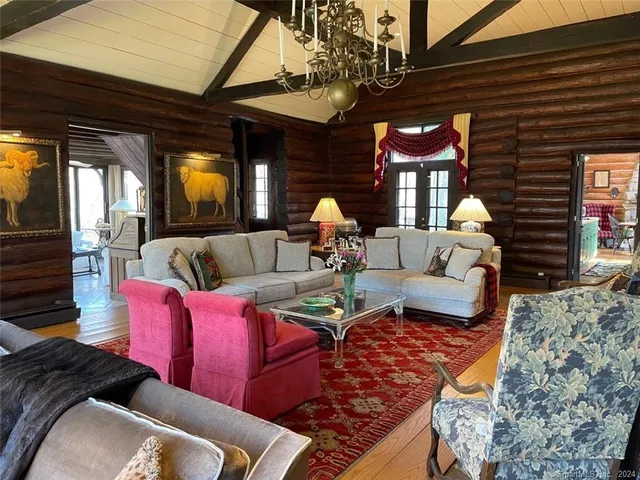 a outdoor space with patio fireplace and couches