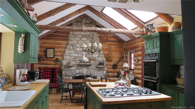 a dining room with furniture and a chandelier