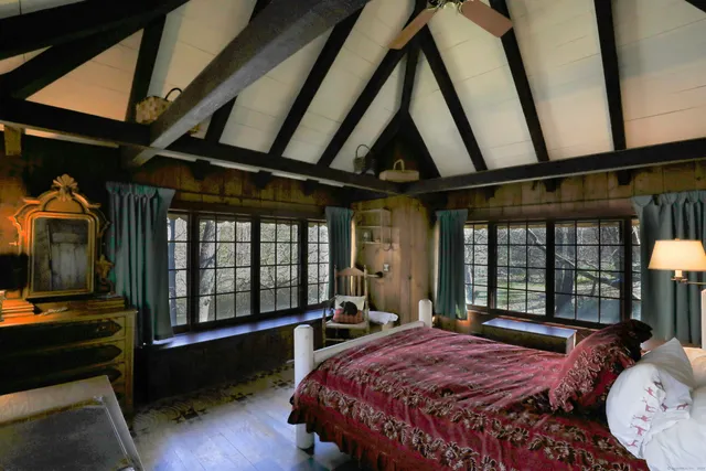 a bedroom with bed and window