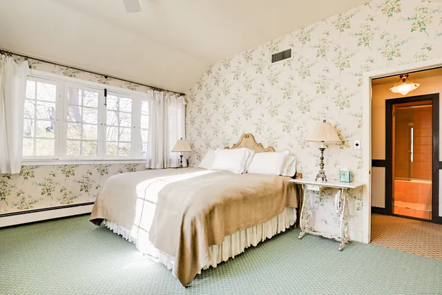 a view of a patio with table and chairs and potted plants