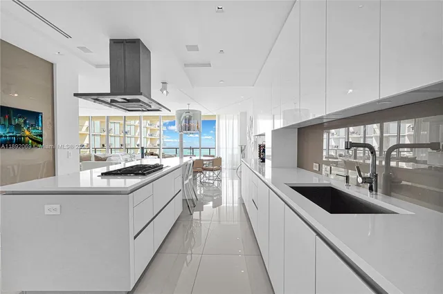 a kitchen with stainless steel appliances granite countertop a stove and a refrigerator