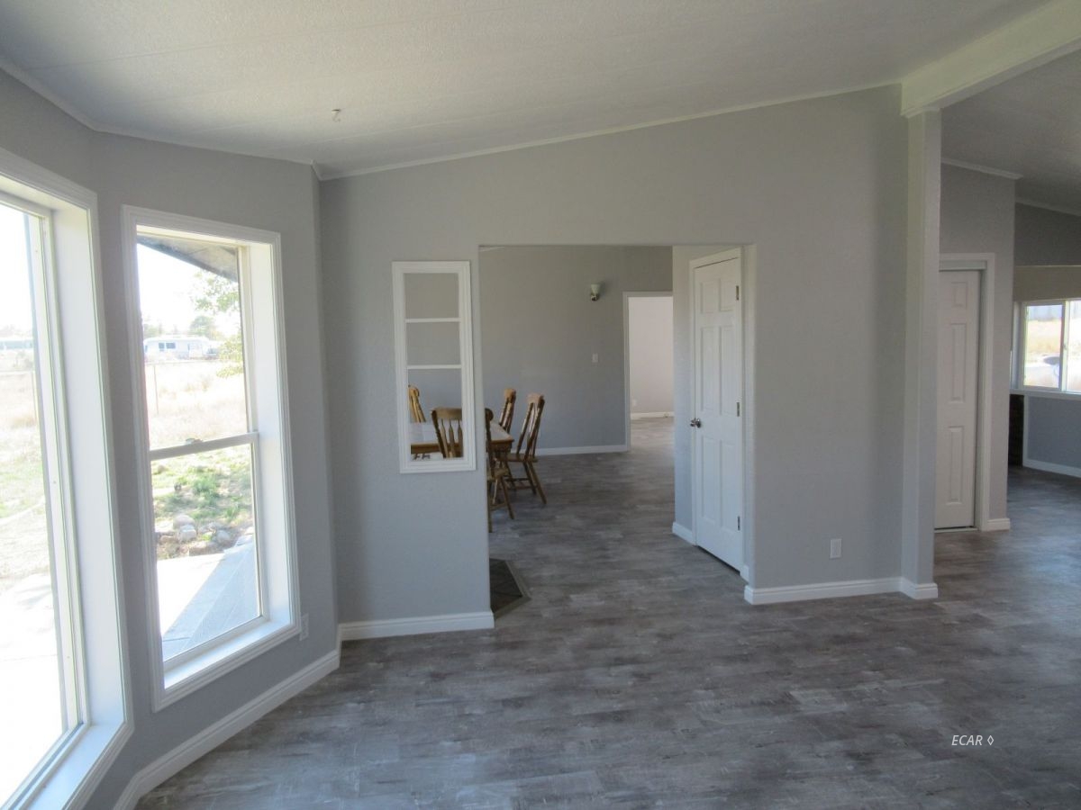 957 Spring Valley Parkway Spring Creek, NV 89815 - Photo 5 of 18 an empty room with windows